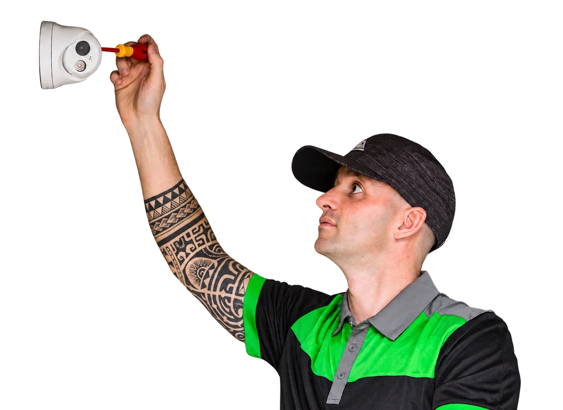Ken working on a CCTV camera, with his complete raised hand visible